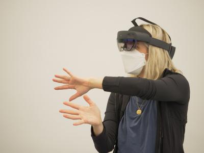 Person with headset and goggles moving.